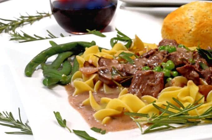 A plate of food with beef and noodles