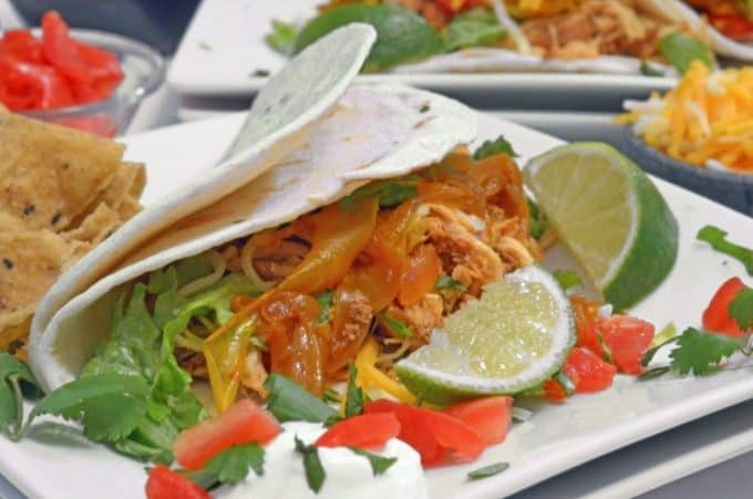 A plate o food with a couple of limes