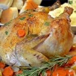 A roast chicken covered in herbs
