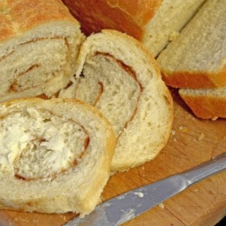 A bunch of homemade bread that is sliced