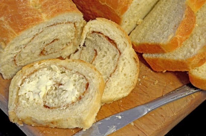 A bunch of homemade bread that is sliced