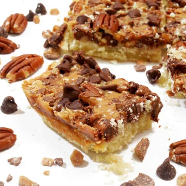 A dessert bar with bits of nuts and chocolate chips.