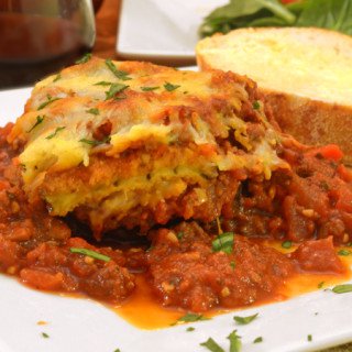 a slice of eggplant parmesan on a plate.