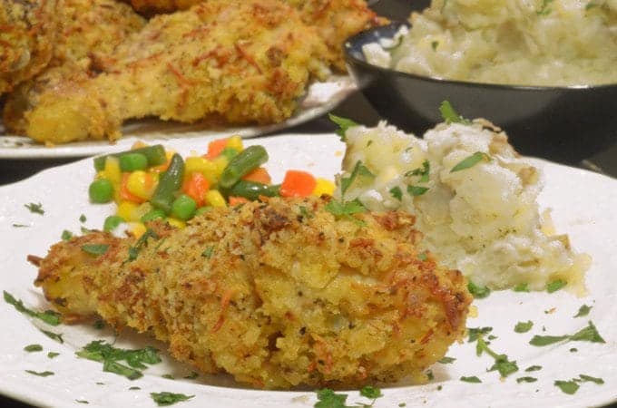 A plate of food with chicken and potatoes