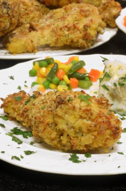 A breaded drumstick on a plate