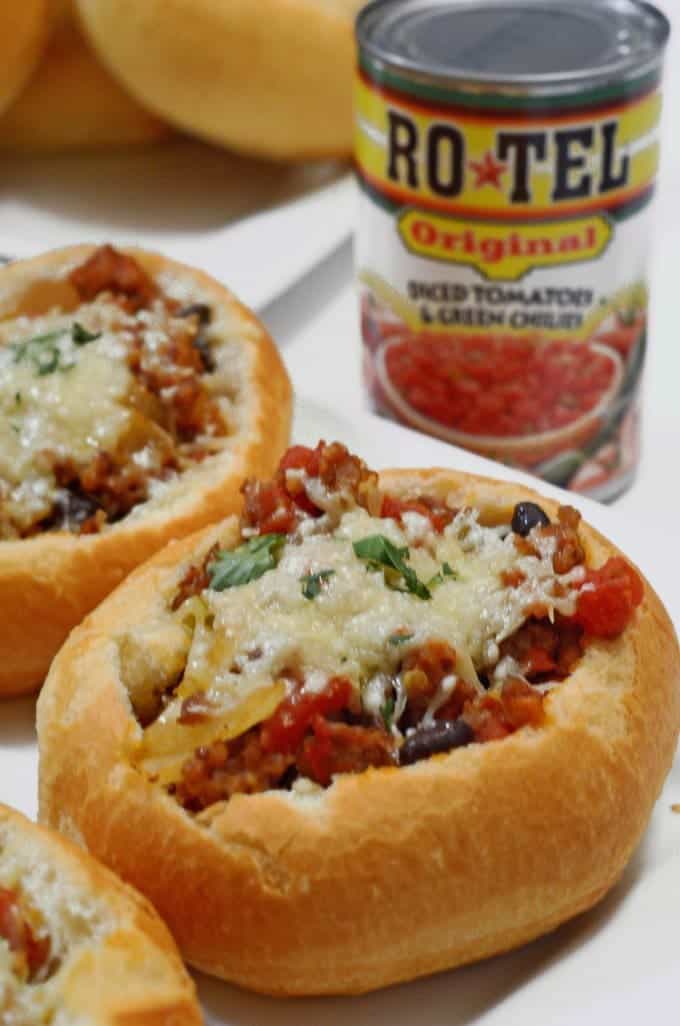 A close up of parmesan sausage bread bowl