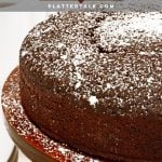 Chocolate cake on pedistal stand with powderred sugar