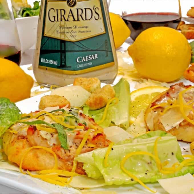 A tray of food on a table, with Pizza and lettuce