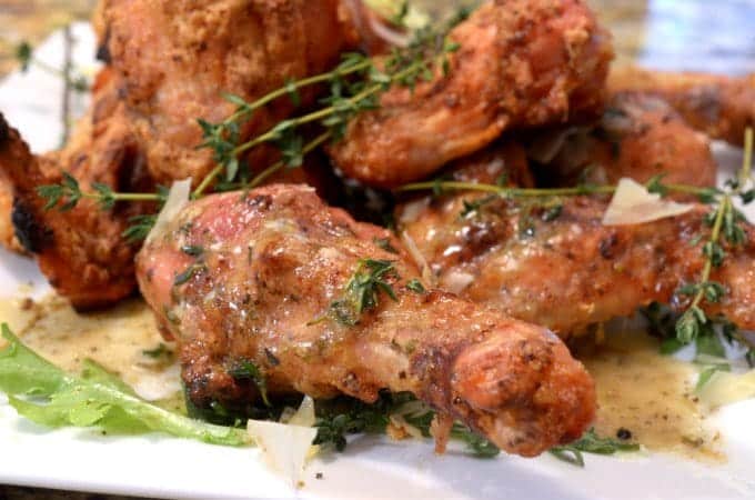 A close up of a plate of chicken wings