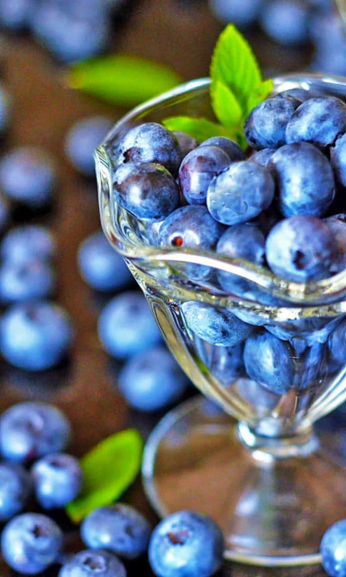 Fresh blueberries in a soup dish.