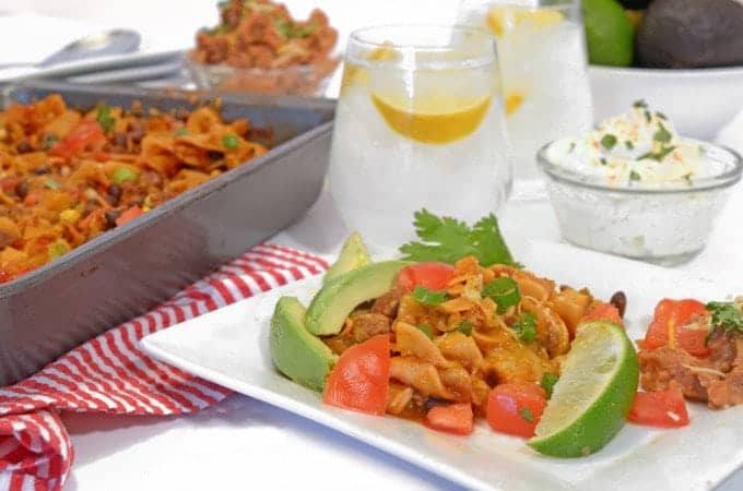 taco casserole with a glass of water