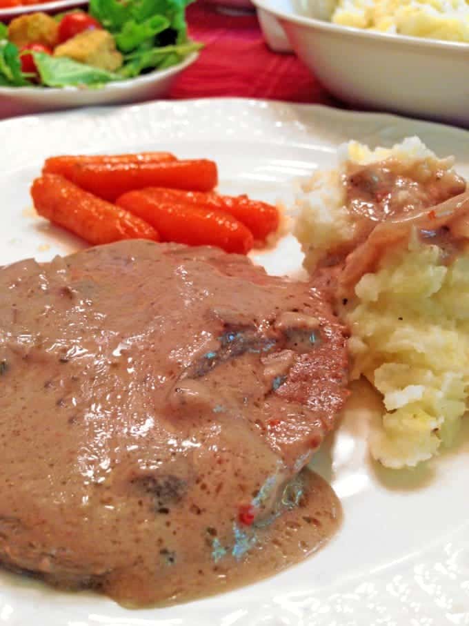 close up of meat, potatoes and carrots