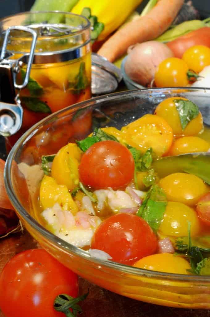 A bunch of tomatoes in a bowl