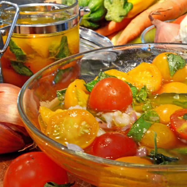 A bowl of marinated tomatoes.
