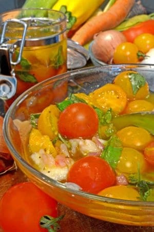 A bowl of tomatoes and basil