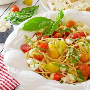 A bowl of pasta with tomatoes