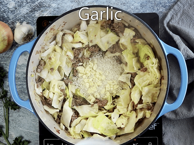 Pan of cut cabbage and sliced garlic