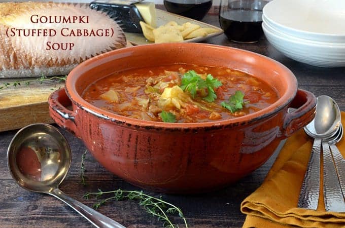 A close up of individual serving bowl of garnished soup on table