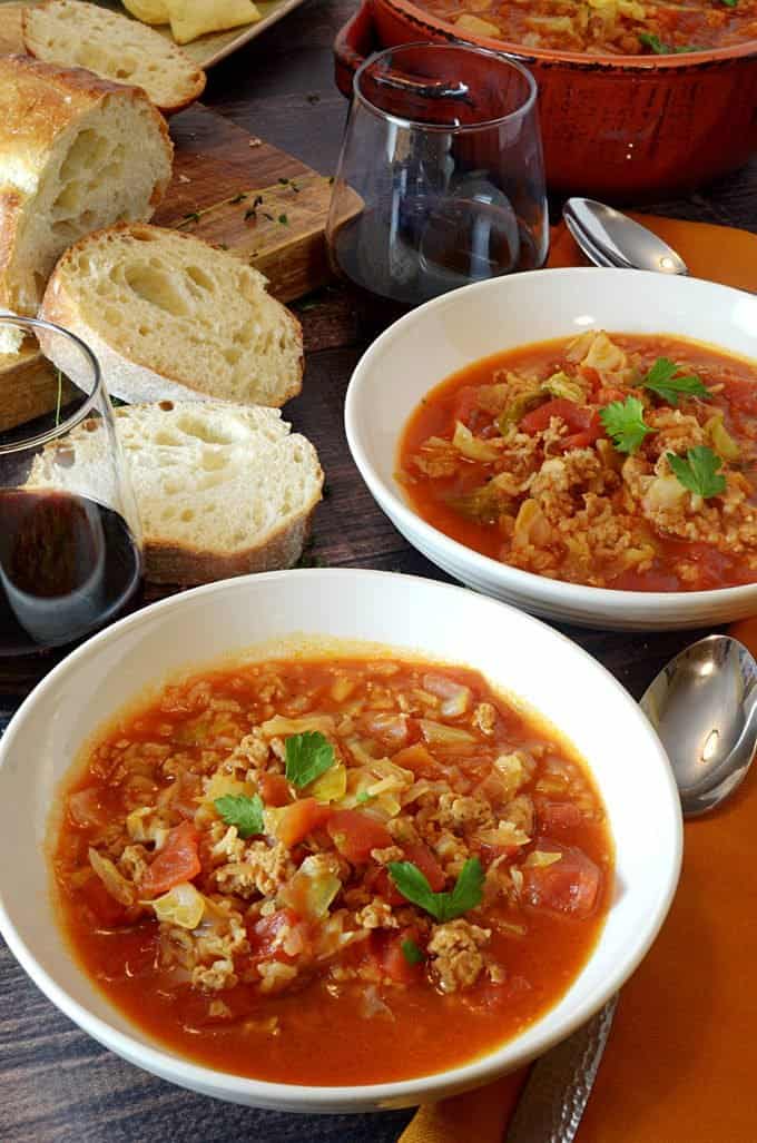 2 bowls cabbage soup with slices of bagette