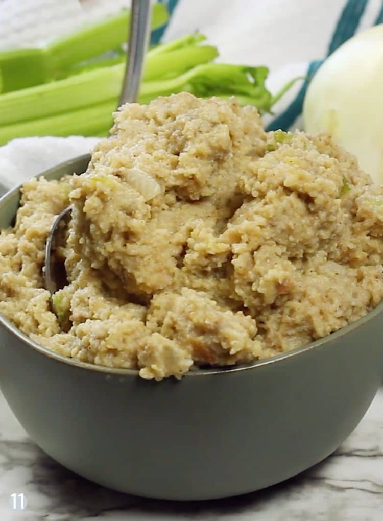 Serivng dish of southern cornbread dressing with spoon.