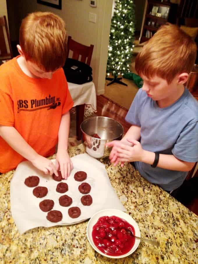 Two boys making cookies
