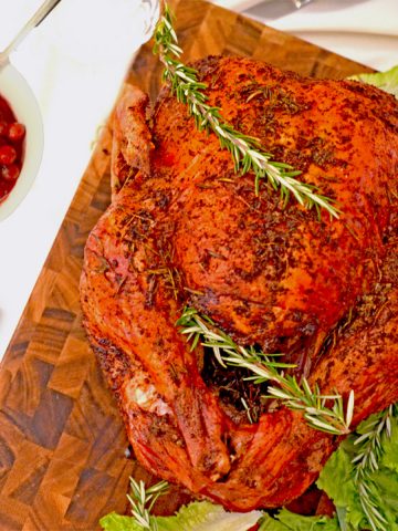 A roasted turkey on a cutting board