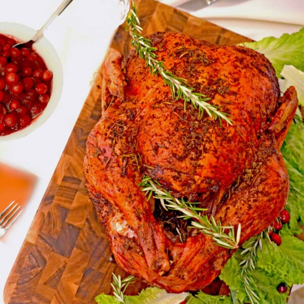 A roasted turkey on a cutting board