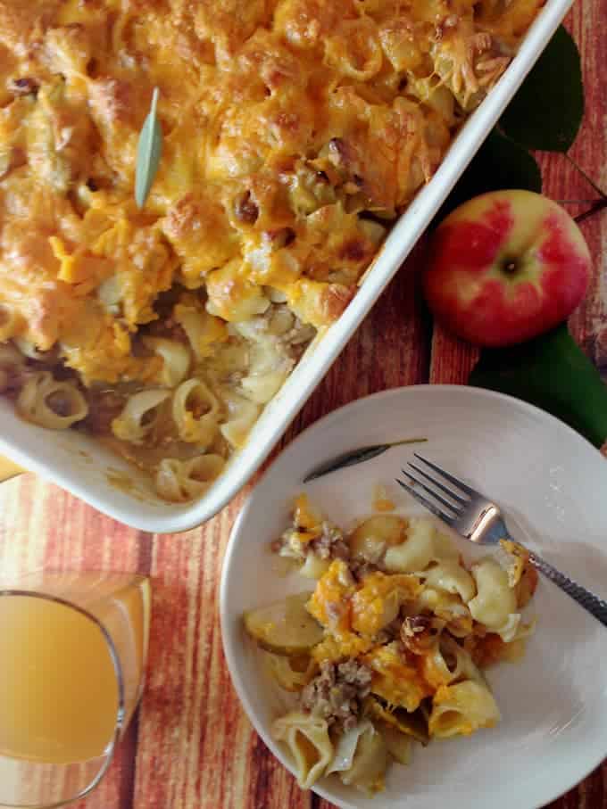 A bunch of food on a table with an apple