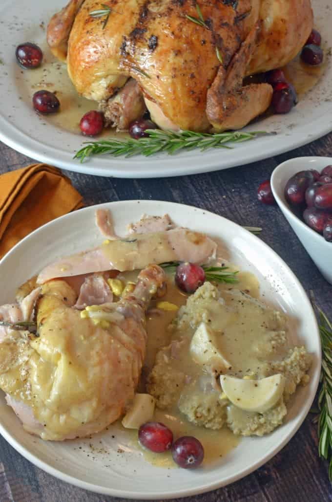 A plate of food on a table, with cornbread dressing and Chicken