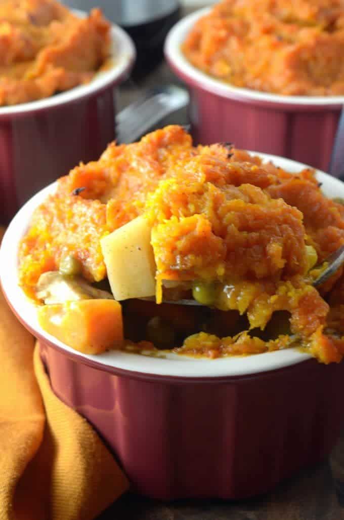 A close up of a bowl of shepherds pie with sweet potato topping