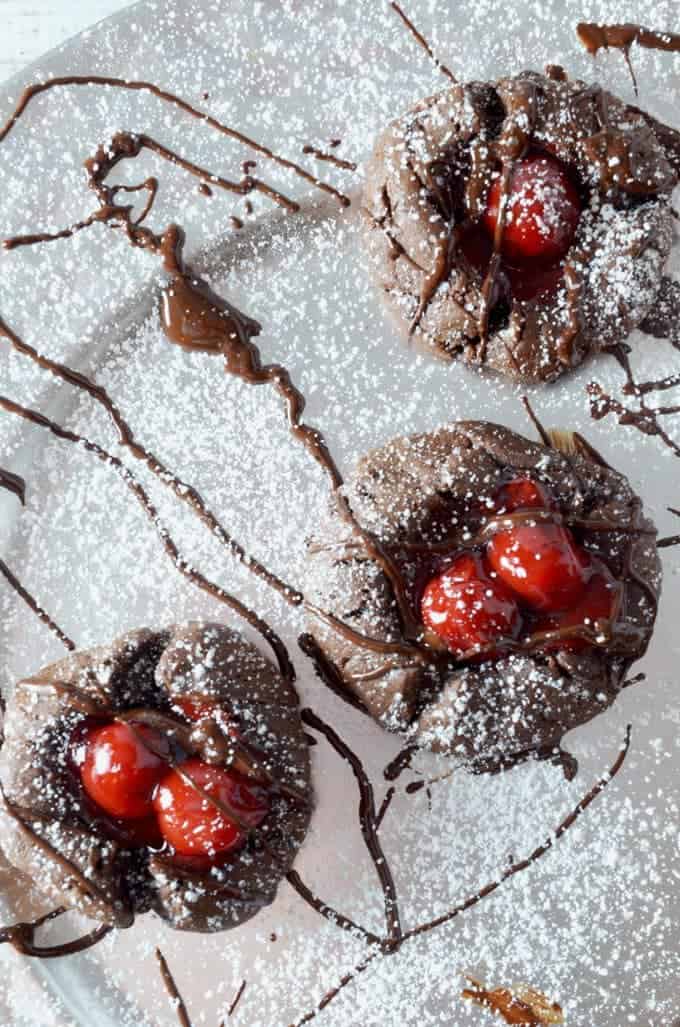 Chocolate cookies with cherries and drizzles of chocolate