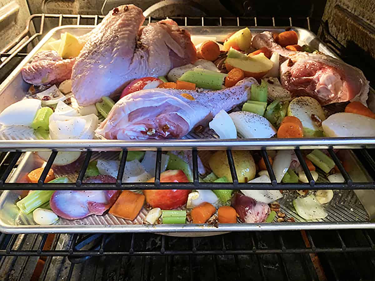 Turkey wings being roasted on an oven rack.