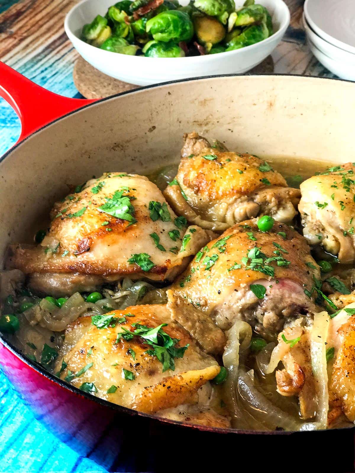 Chicken thighs in whiskey sauce cooking in a pan.