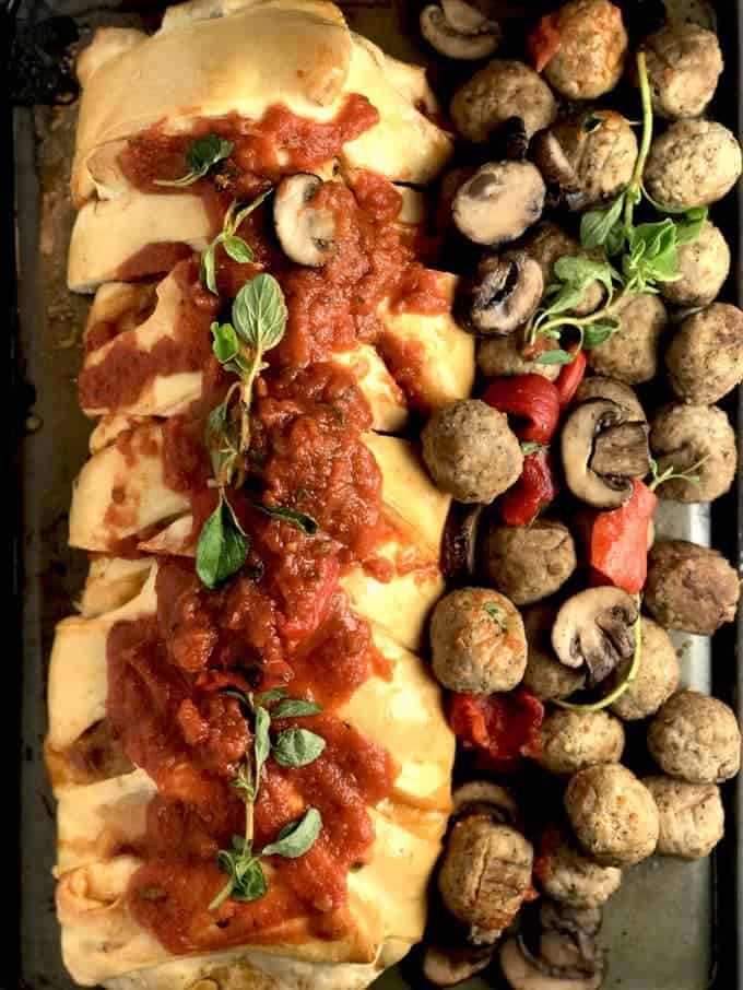 A bunch of different types of food, with Meatball and Stromboli