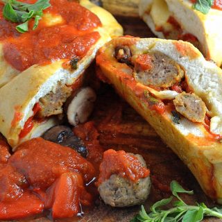 A close up of food, with Meatball and Stromboli