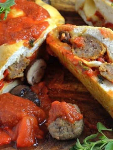 A close up of food, with Meatball and Stromboli