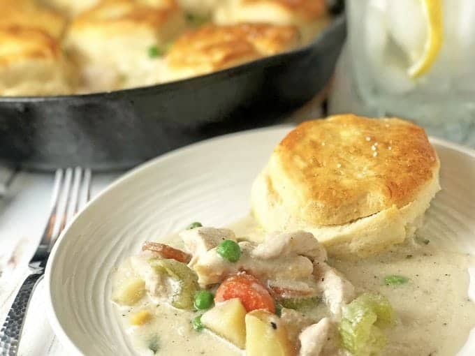 Serving of chicken pot pie with biscuit.