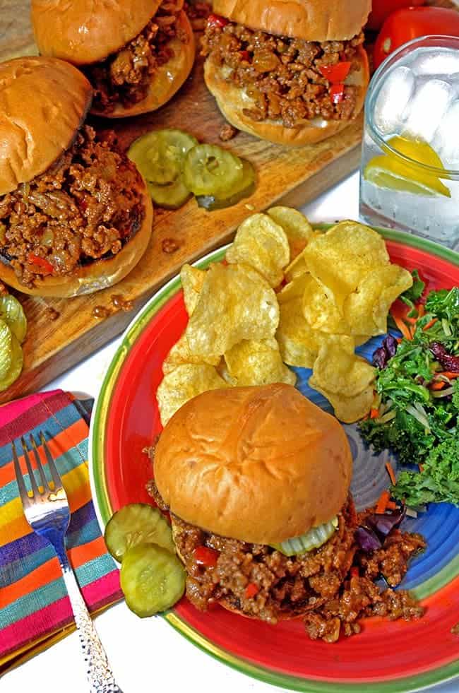 Sloppy Joe plated with chips and salad pm table