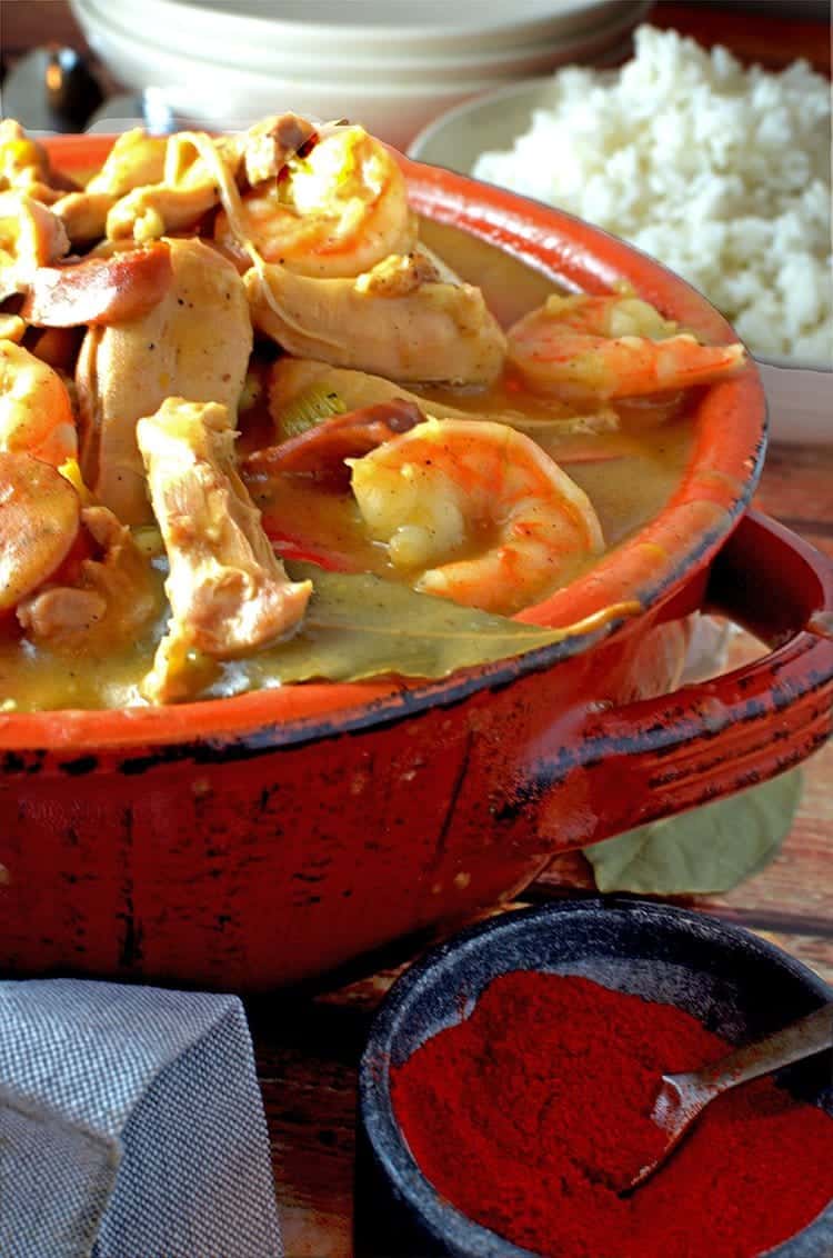 A bowl of gumbo with rice.