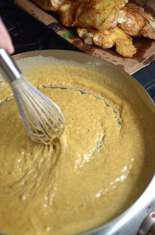 Stirring a roux for sausage and chicken gumbo.