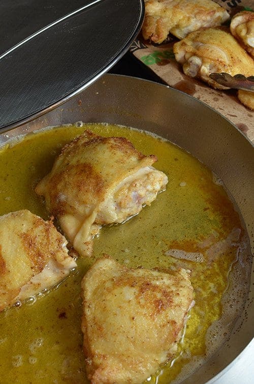 Searing seasoned chicken for sausage and chicken gumbo.