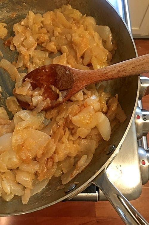 Cauliflower latke is topped with caramelized onions.