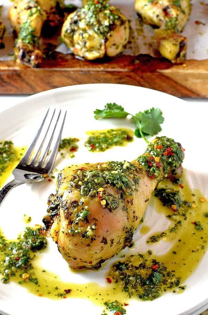 A plate of food with Chicken and Chimichurri sauce