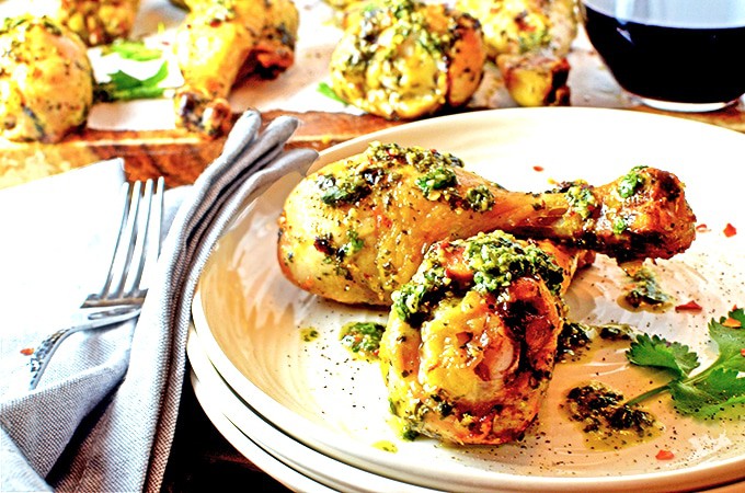 Plate or chicken drumsticks with cilantro