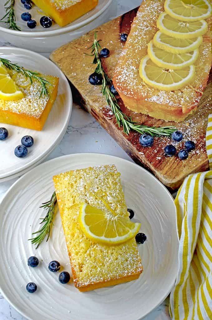 A bunch of lemon loaf cake on a cutting board