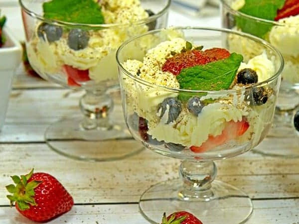 Mascarpone mouse with strawberries and blueberries desserts in coupes