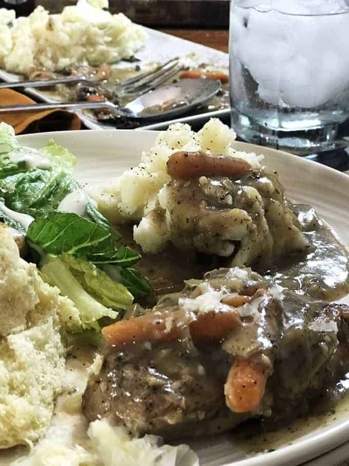 Meat, gravy and vegetables with mashed potato