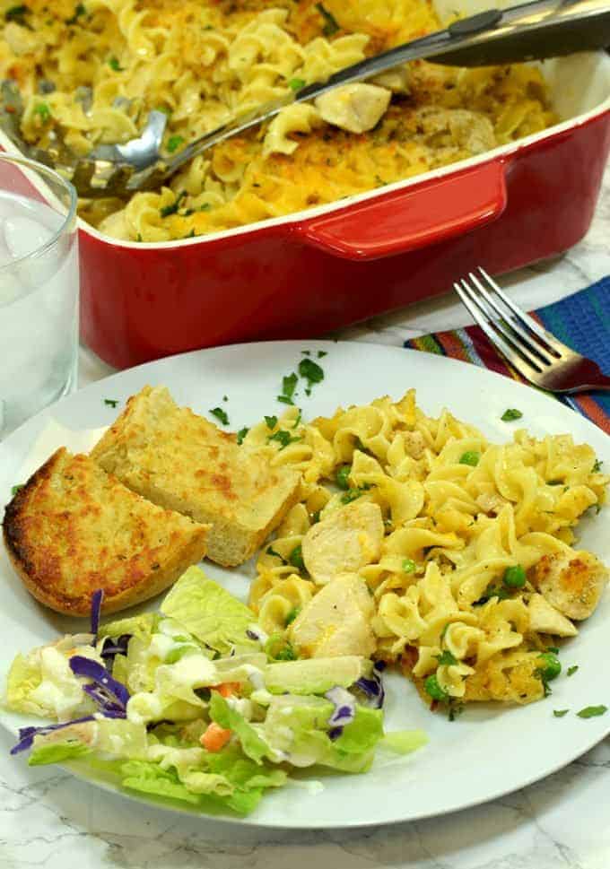 A plate of food on a table, with Chicken and Noodle