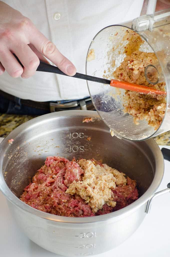 Making mozzarella stuffed meatballs which are a great potlcuk idea for work.