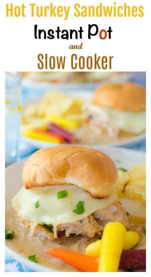 2 hot turkey sandwich plates with chips and vegetables
